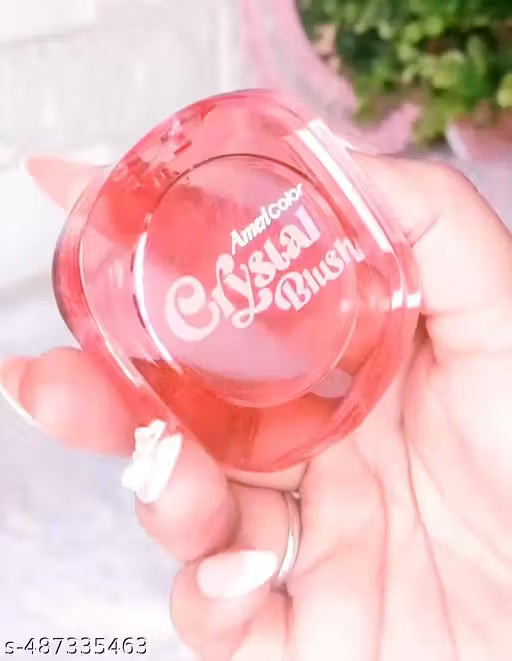 Portable transparent magic crystal blush compact with color-changing effect held in hand